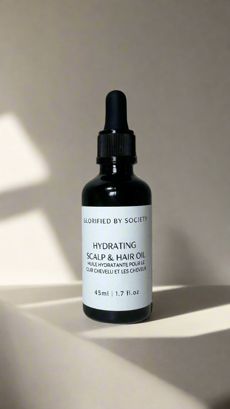 All-natural hydrating scalp and hair oil with almond, jojoba, castor, rosemary, and essential oils to promote hair growth, moisture, and scalp health.